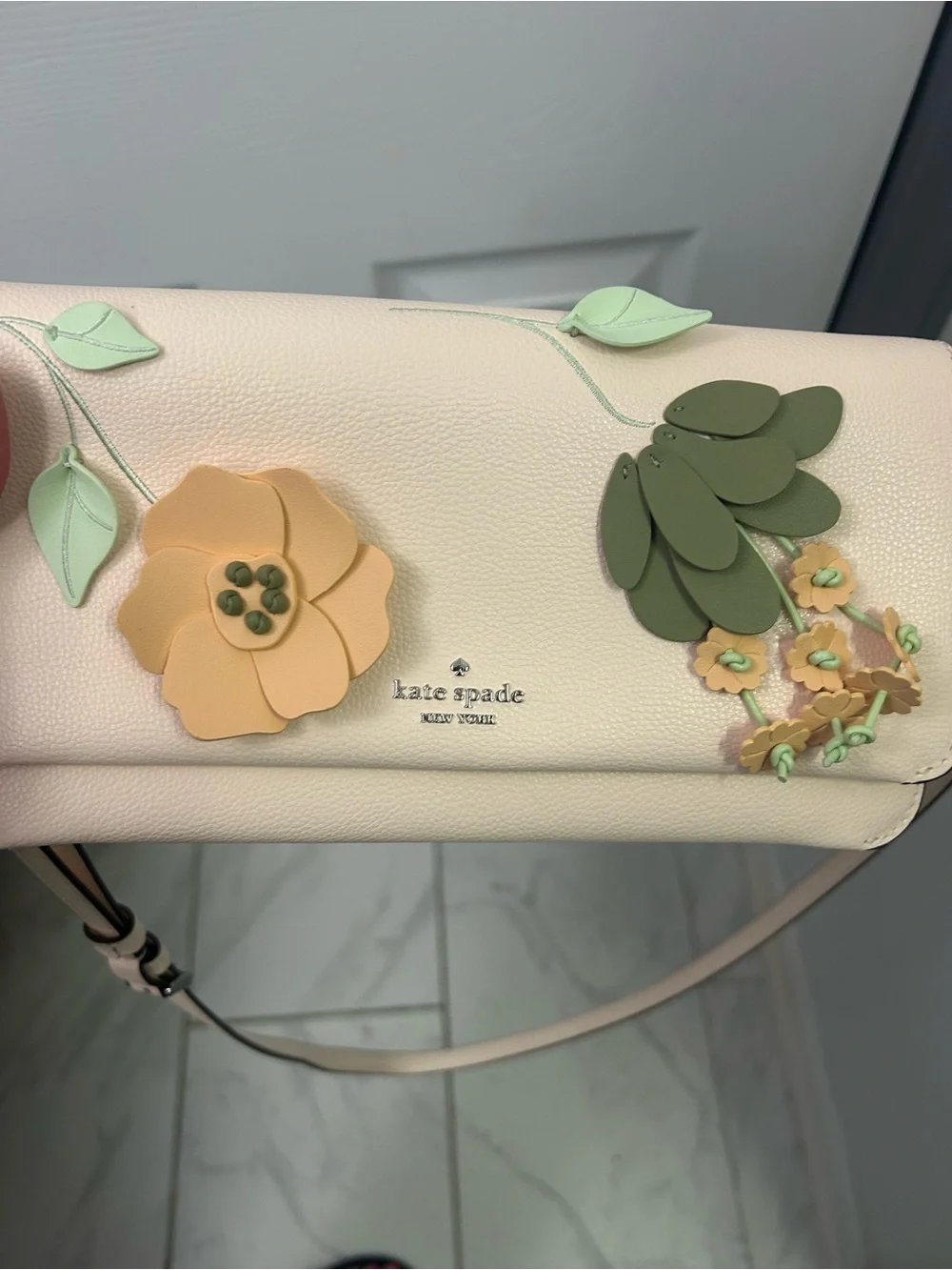 NWOT KATE SPADE floral appliqué leather crossbody bag.